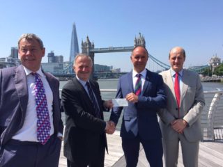 AVM NIck Kurth CBE presents WO1 Lou Rudd with the second half of the Ulysses Trust £30K donation.  Image also features Ian Hannam (left) and Dr Rod Stables, Ulysses Trust Trustee (right).